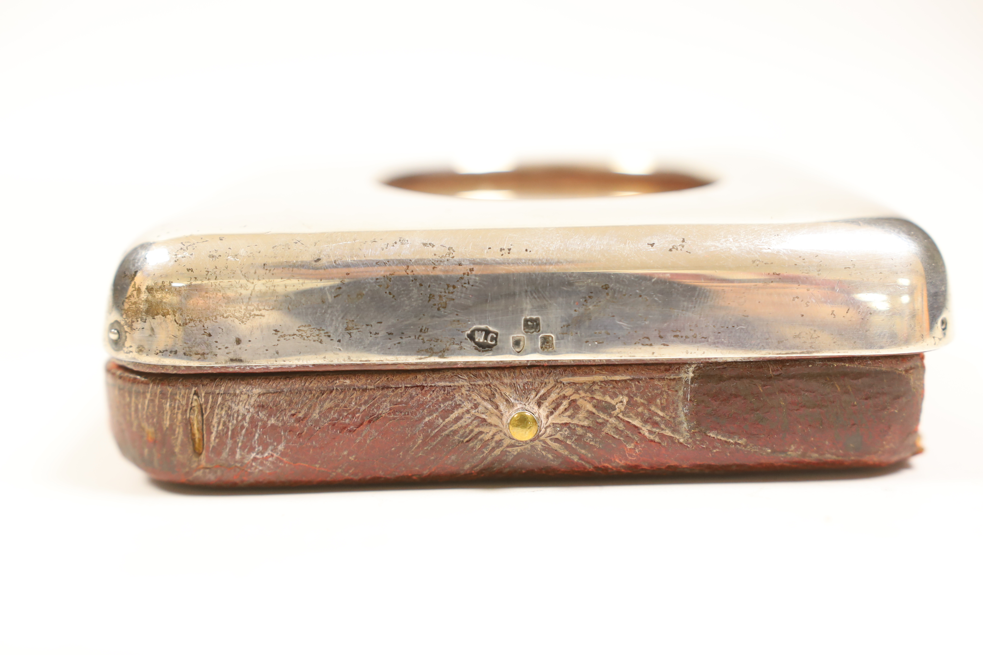 A nickel cased Goliath pocket barometer, in silver mounted travelling case, London, 1897, 11.1cm.